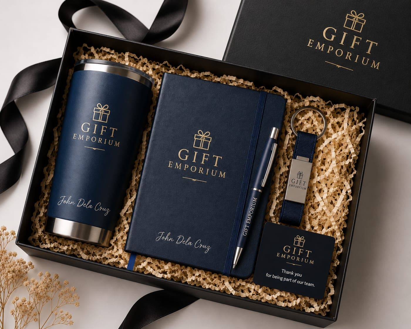 Personalized navy corporate gift set — tumbler, journal, pen and keychain branded by Gift Emporium